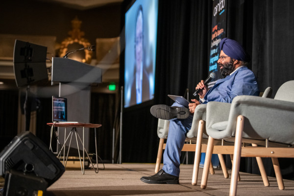 Inder Monga on stage with Ben Brown on a monitor