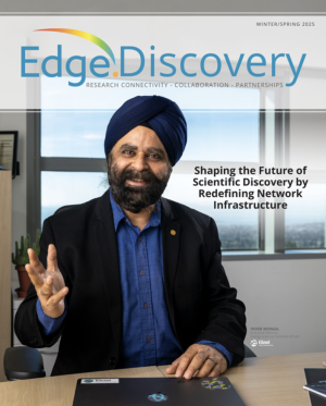 Magazine cover with man seated at a table raiding a hand while talking