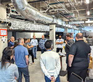 Group of people in a circle in an industrial area